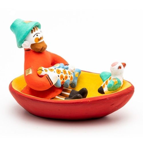 Фигурка "Мужик в лодке с рыбой и птичкой"